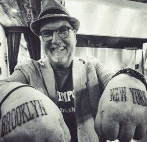 Happy Tour Guide with tattoos on hands Brooklyn New York