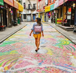 Lady walking through colorful Chinatown